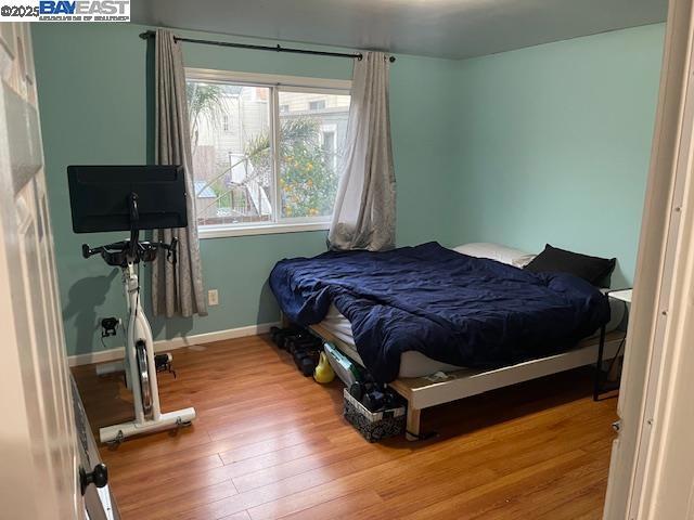 1827 Alemany Boulevard San Francisco, CA 94112 - Photo 10 of 12 a bed sitting in a bedroom next to a window