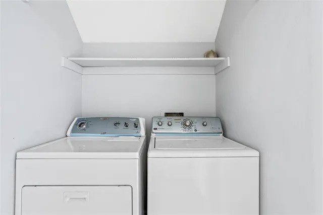 a utility room with dryer and washer