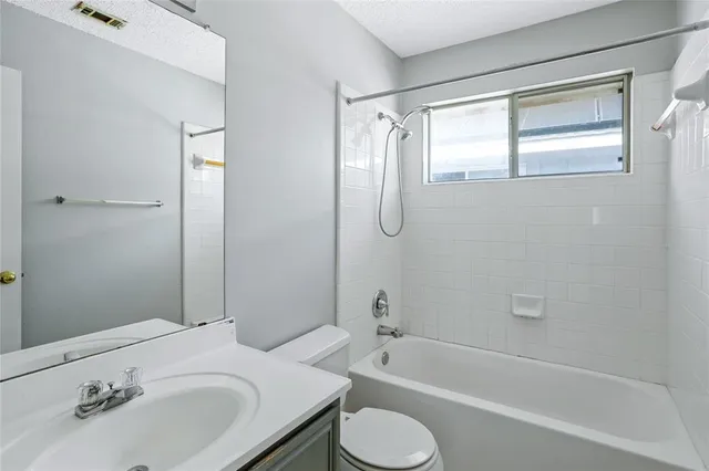 a bathroom with a sink toilet and bathtub