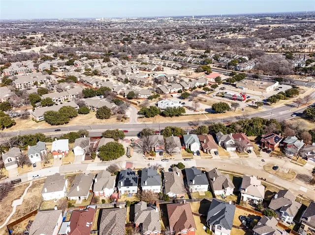 an aerial view of residential building and parking space