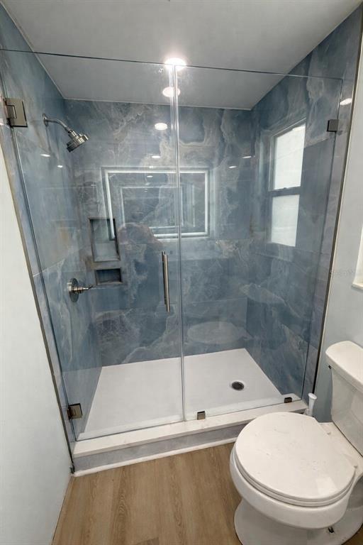 676 El Centro Longboat Key, FL 34228 - Photo 3 of 6 a bathroom with a toilet and a shower