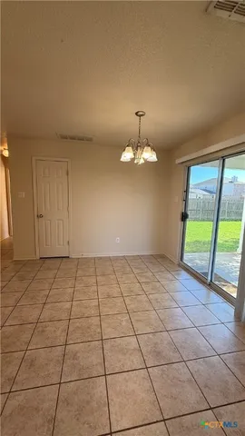 a kitchen with stainless steel appliances granite countertop a refrigerator and a stove