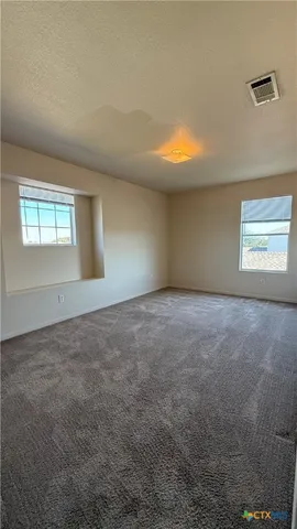 a view of room with window and hardwood floor
