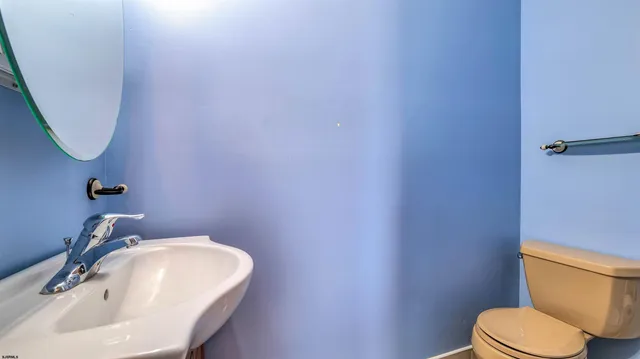 a bedroom with a bed and a tv