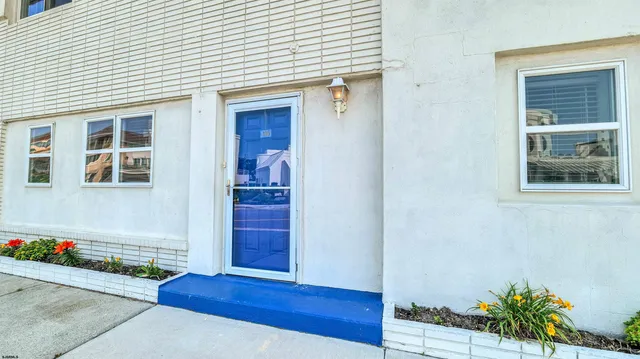 a kitchen with a refrigerator and a sink