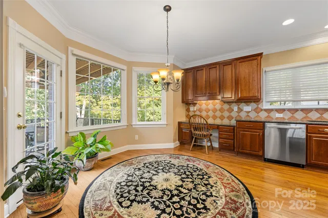 a kitchen with stove and cabinets