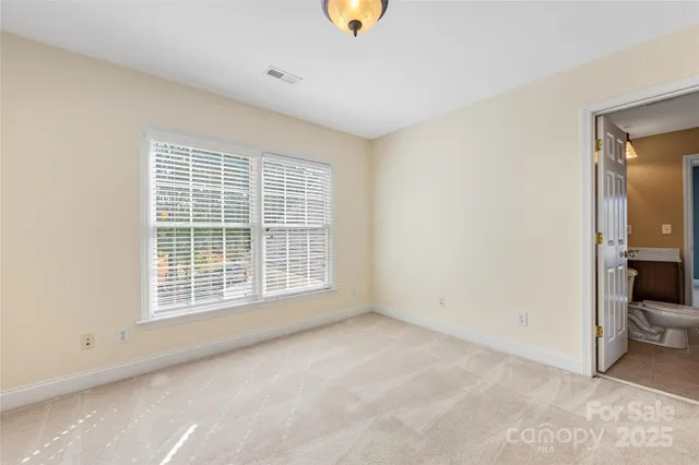 a view of a room with a large window