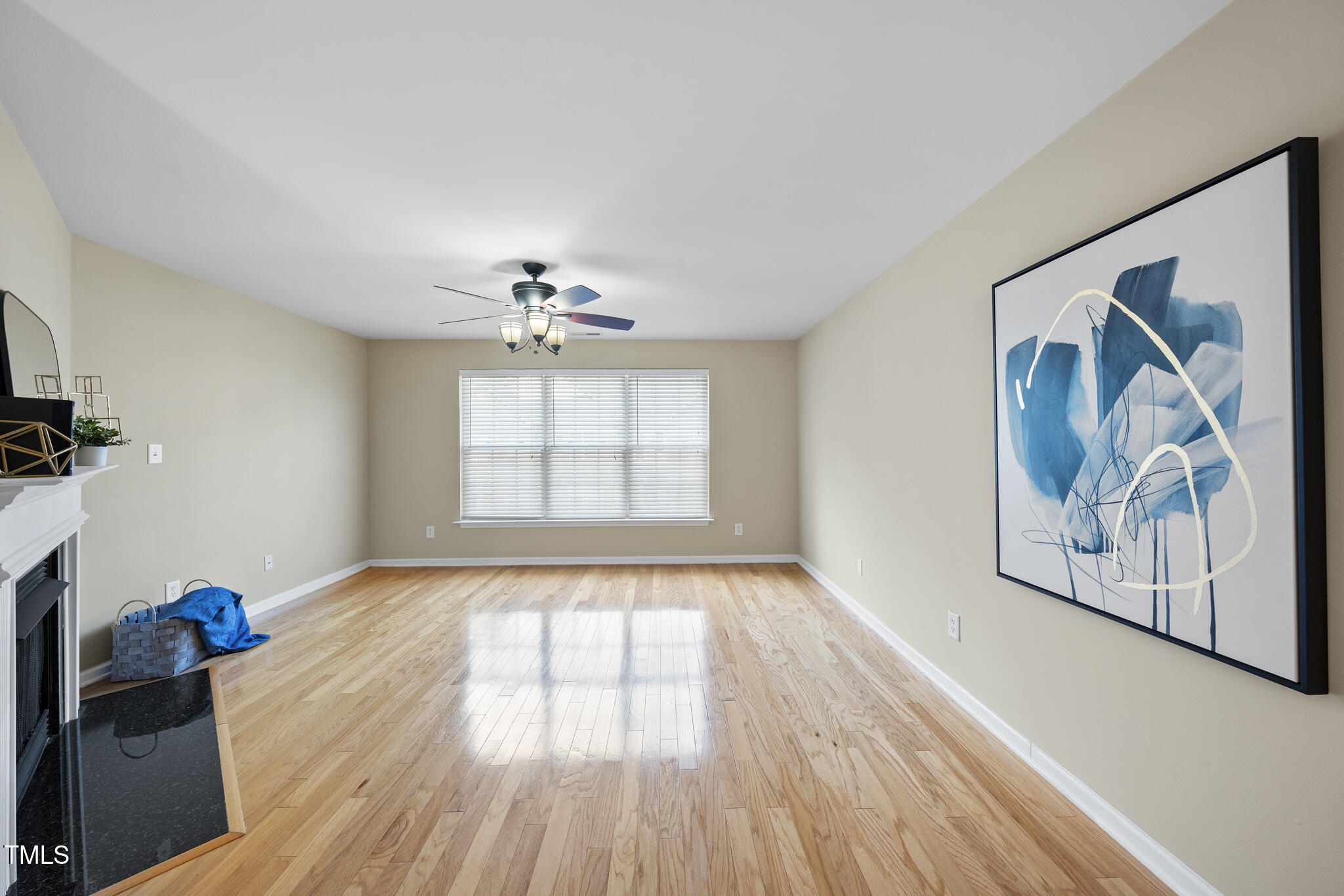 9910 Clyborn Court Raleigh, NC 27617 - Photo 11 of 19 a view of an empty room window and wooden floor