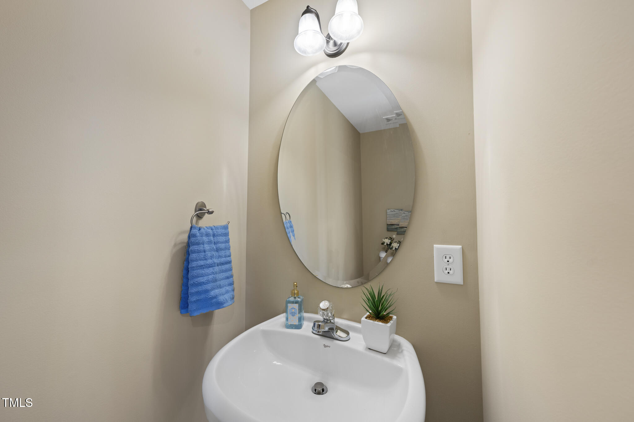 9910 Clyborn Court Raleigh, NC 27617 - Photo 12 of 19 a bathroom with a sink and a mirror