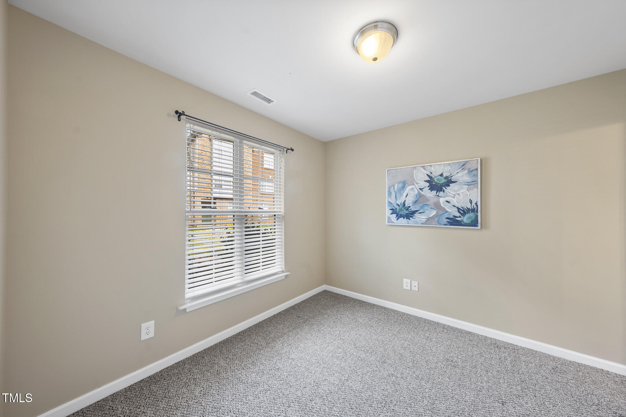 9910 Clyborn Court Raleigh, NC 27617 - Photo 16 of 19 an empty room with a window