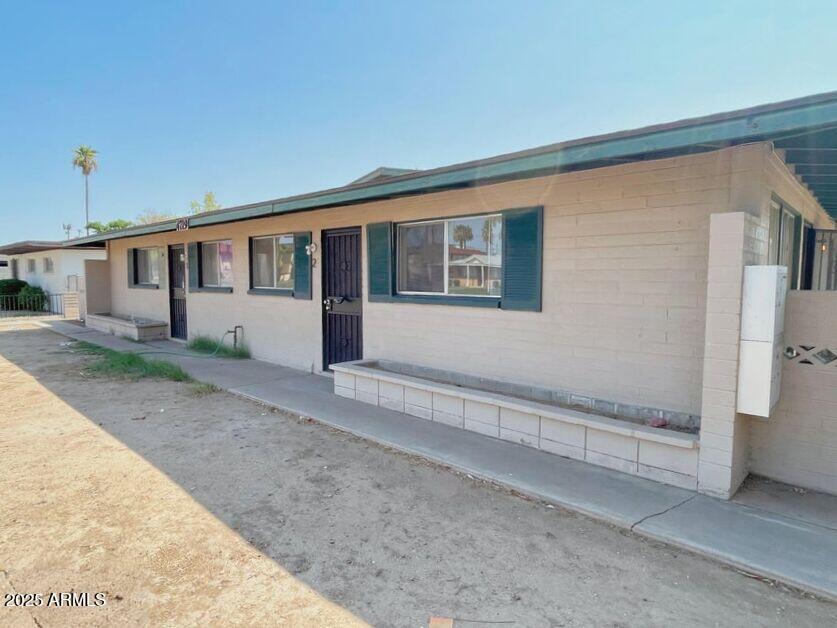 4719 North 15th Avenue, Unit 3 Phoenix, AZ 85015 - Photo 1 of 12 a house view with a backyard space