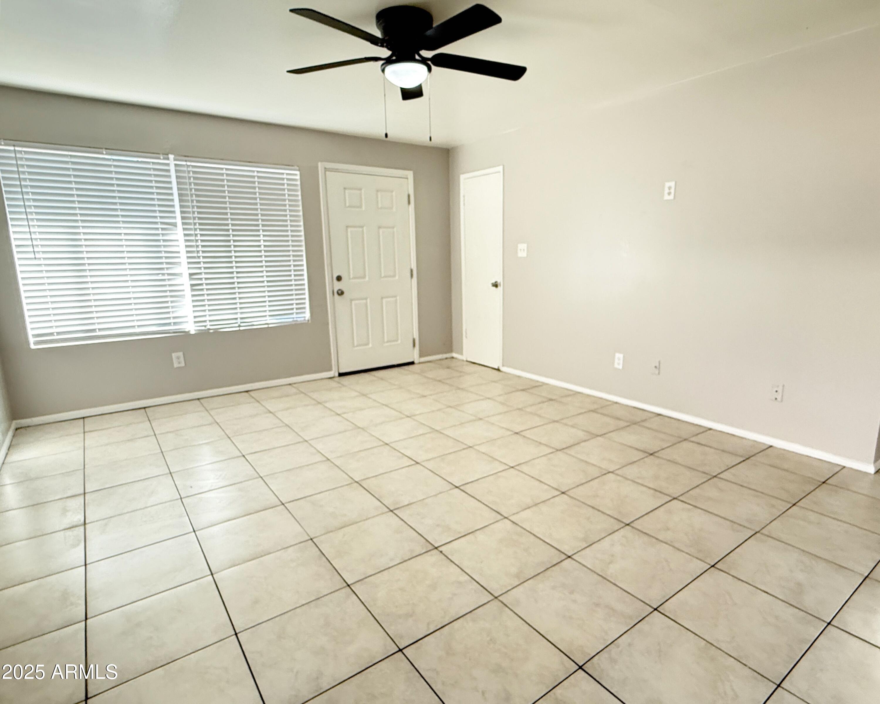 4719 North 15th Avenue, Unit 3 Phoenix, AZ 85015 - Photo 2 of 12 a view of an empty room and a window