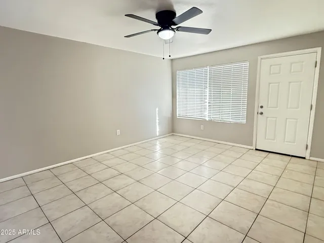 a view of an empty room and a window