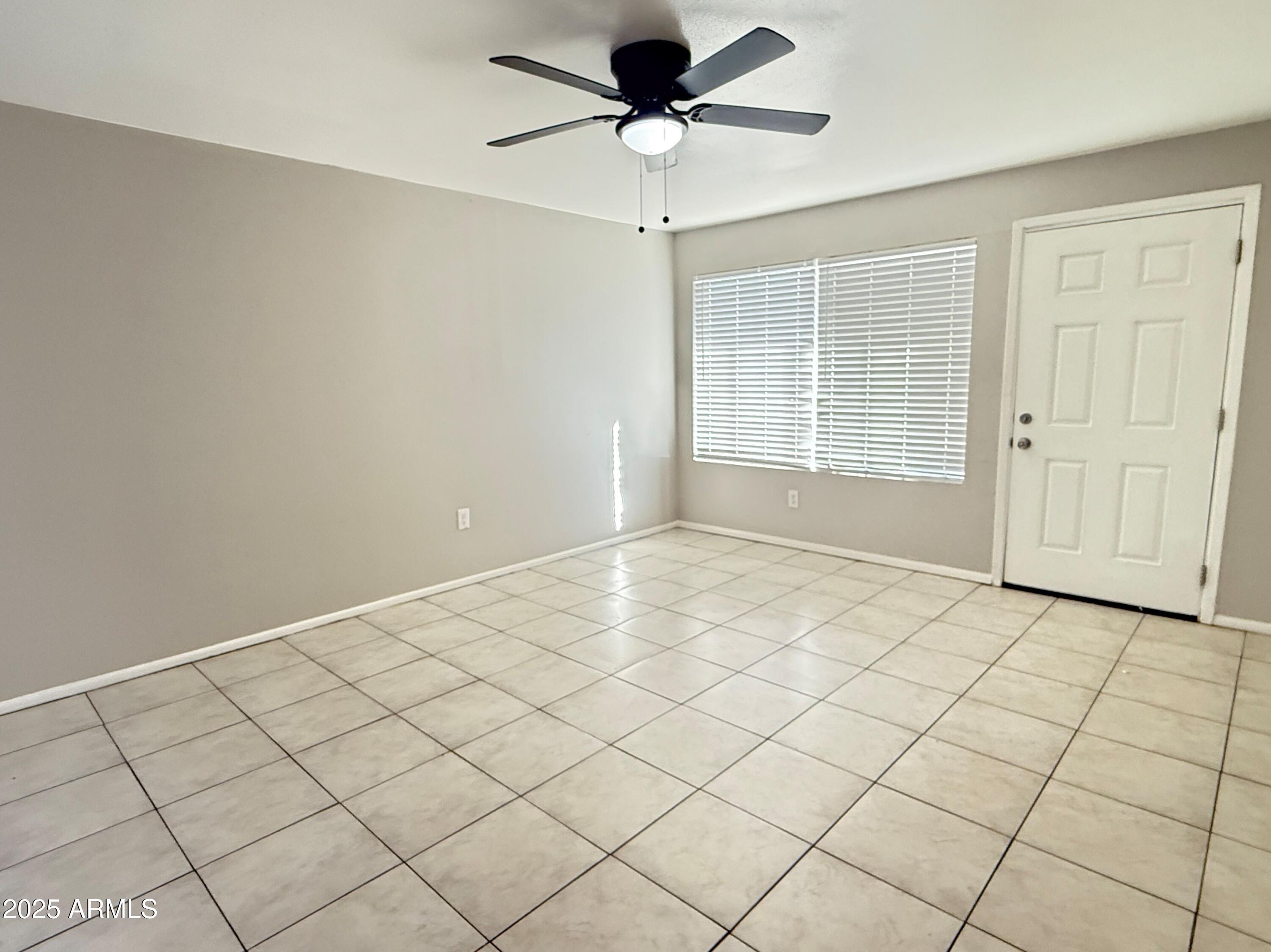 4719 North 15th Avenue, Unit 3 Phoenix, AZ 85015 - Photo 3 of 12 a view of an empty room and a window