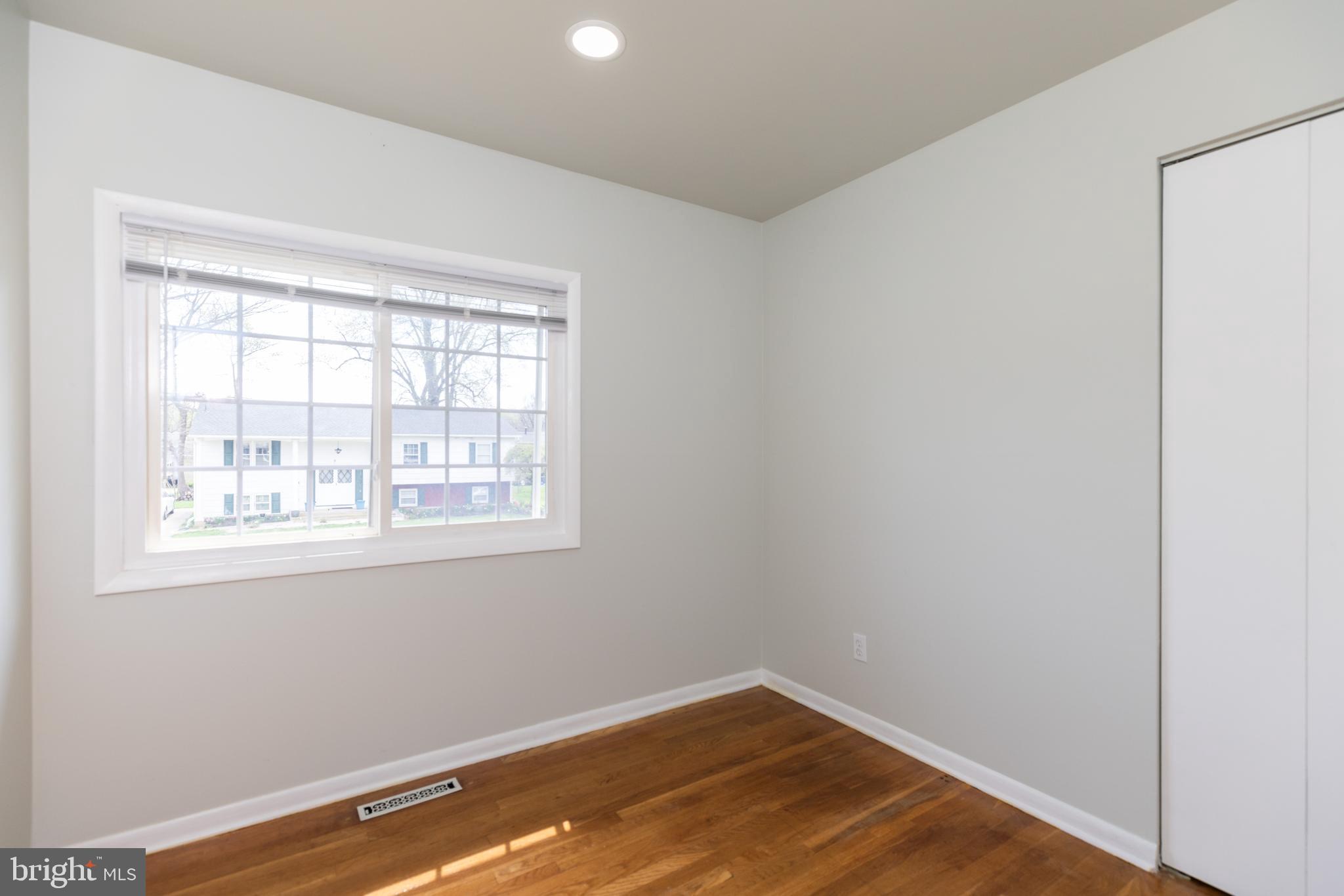 12 Alwyn Road Newark, DE 19713 - Photo 15 of 31 an empty room with wooden floor and a window