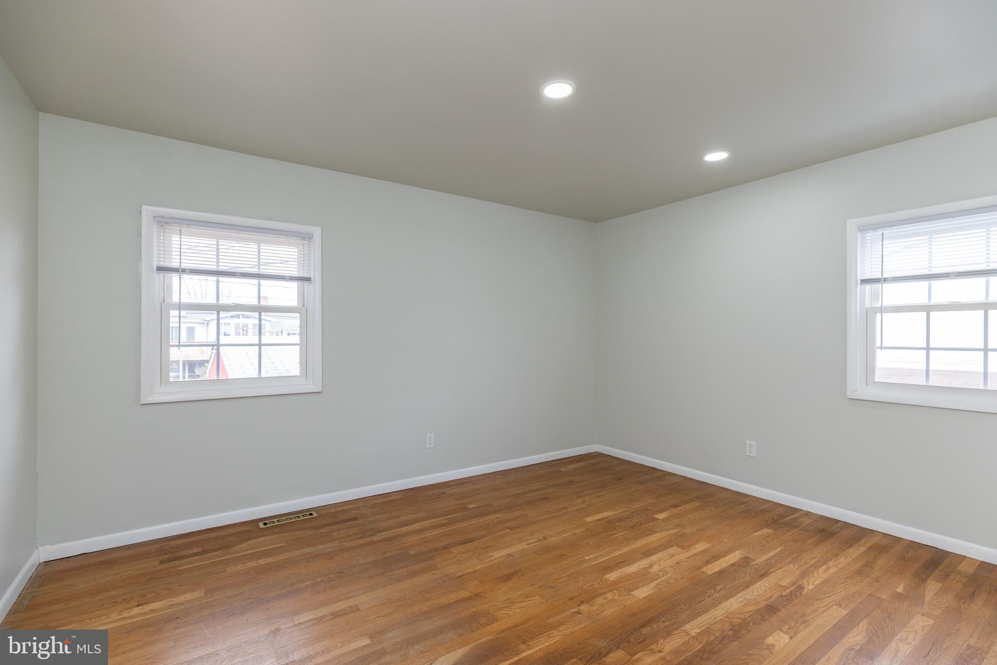 12 Alwyn Road Newark, DE 19713 - Photo 17 of 31 an empty room with wooden floor and windows