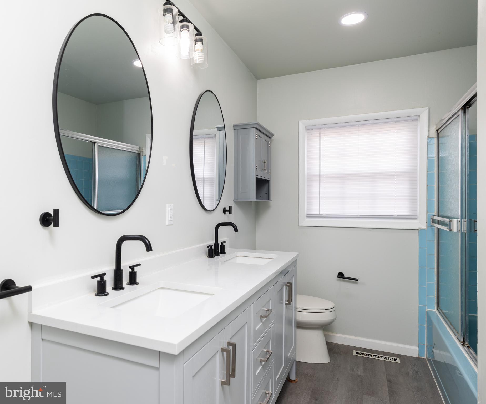 12 Alwyn Road Newark, DE 19713 - Photo 20 of 31 a bathroom with a double vanity sink and a mirror