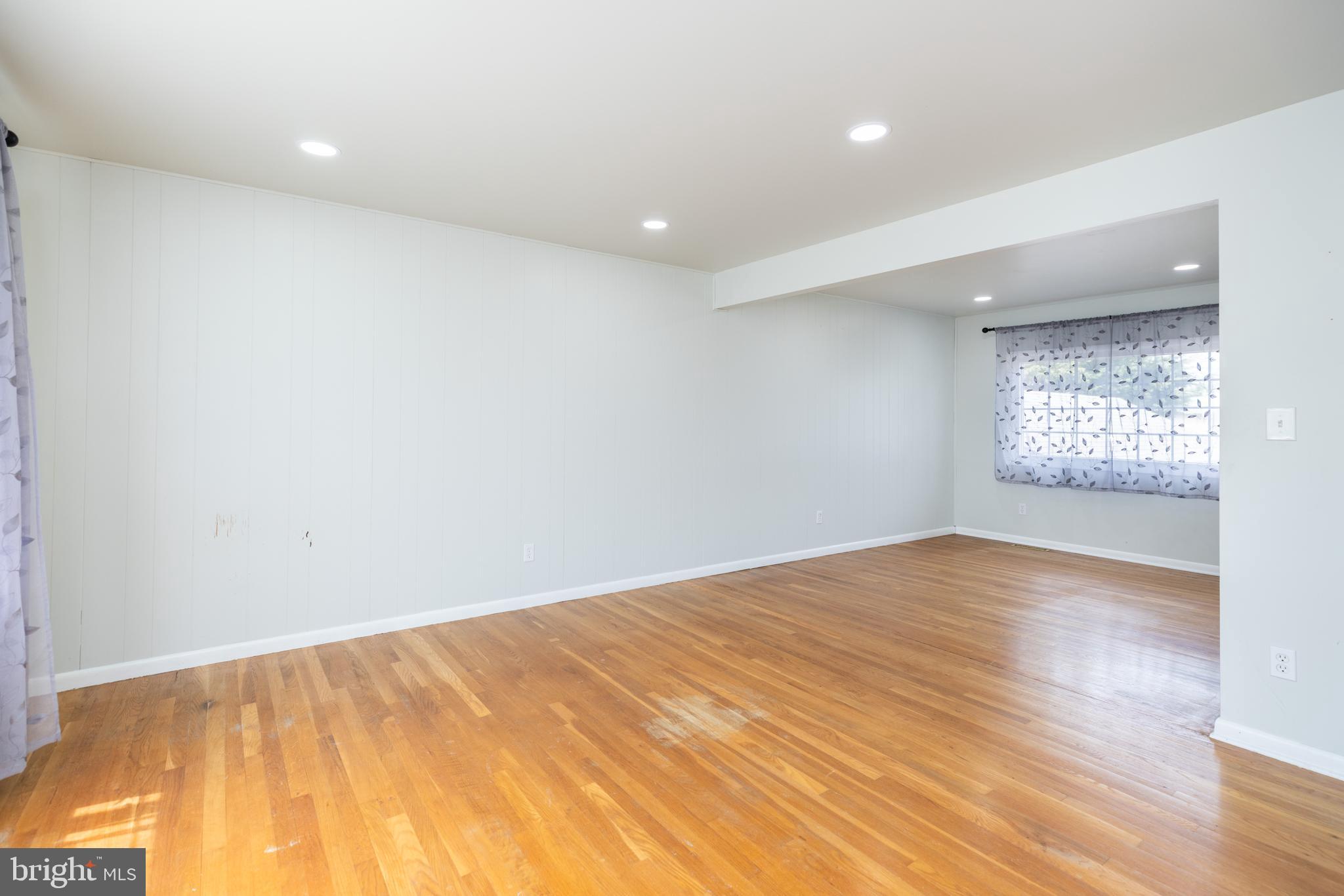 12 Alwyn Road Newark, DE 19713 - Photo 5 of 31 an empty room with wooden floor and windows