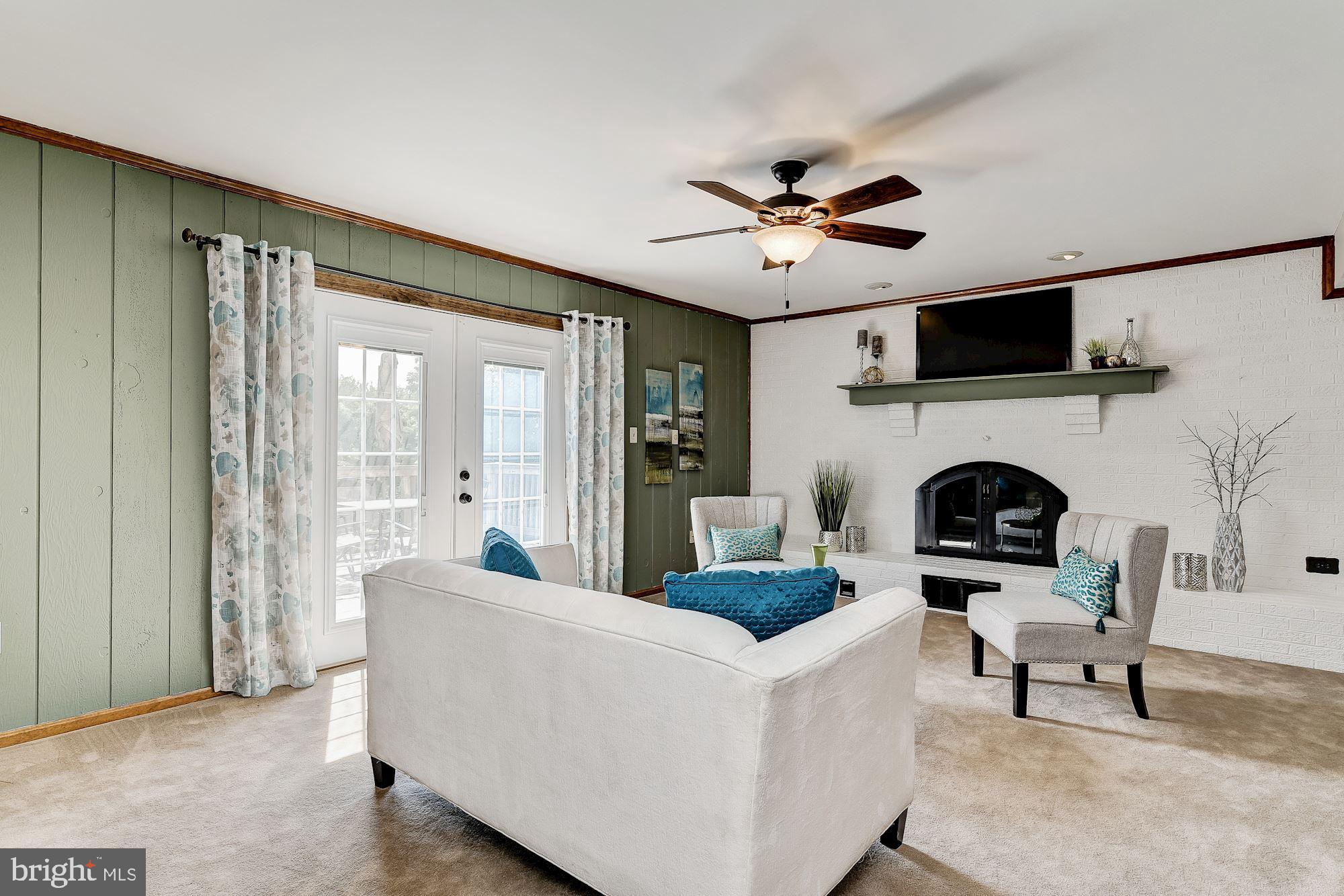 10685 Stansfield Road Laurel, MD 20723 - Photo 11 of 48 Family room with wood-burning fireplace.
