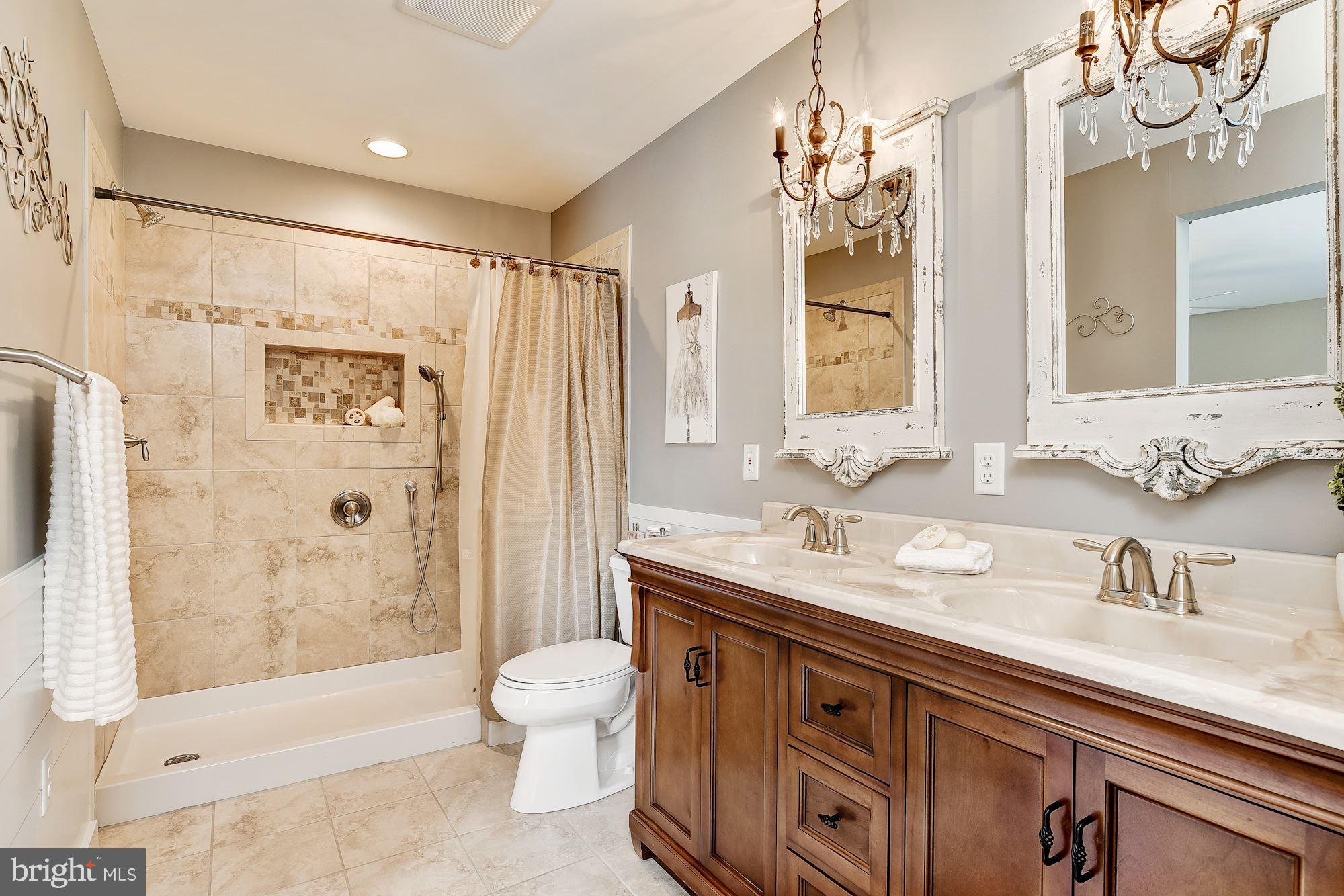 10685 Stansfield Road Laurel, MD 20723 - Photo 16 of 48 Updated master bathroom with chandeliers.