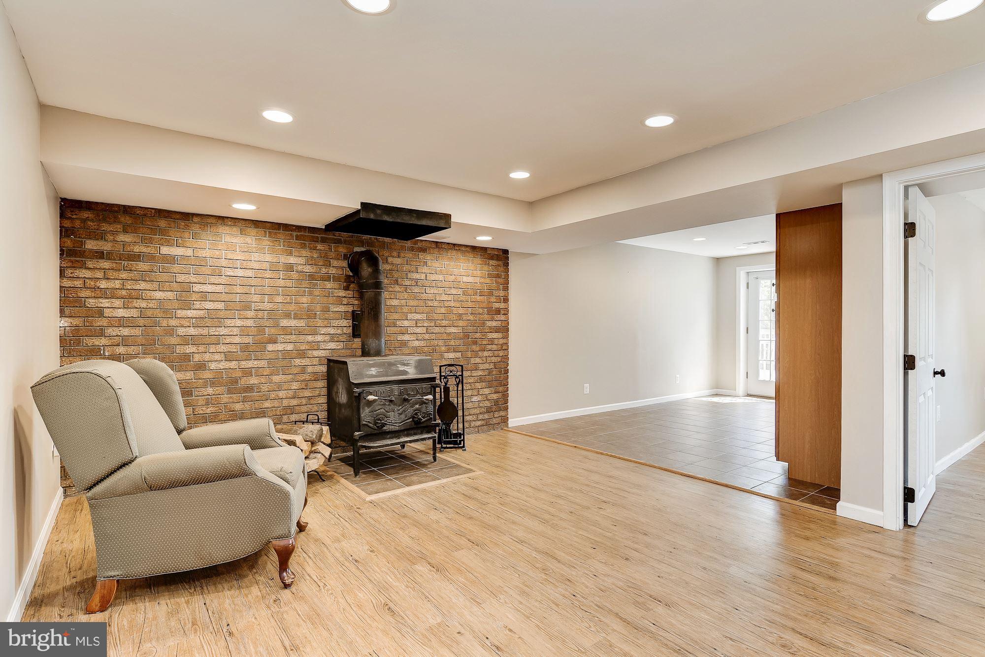 10685 Stansfield Road Laurel, MD 20723 - Photo 23 of 48 In-law suite den with wood stove.