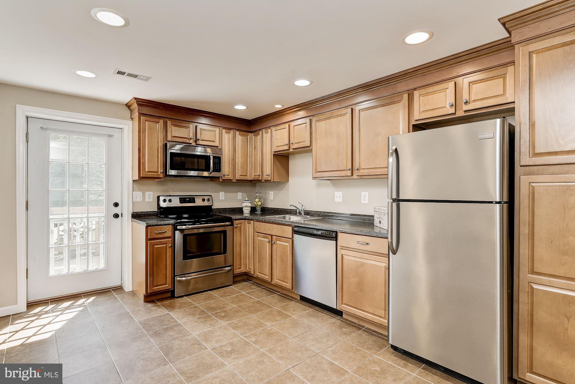 10685 Stansfield Road Laurel, MD 20723 - Photo 24 of 48 In-law suite with full kitchen, door to 2nd deck.