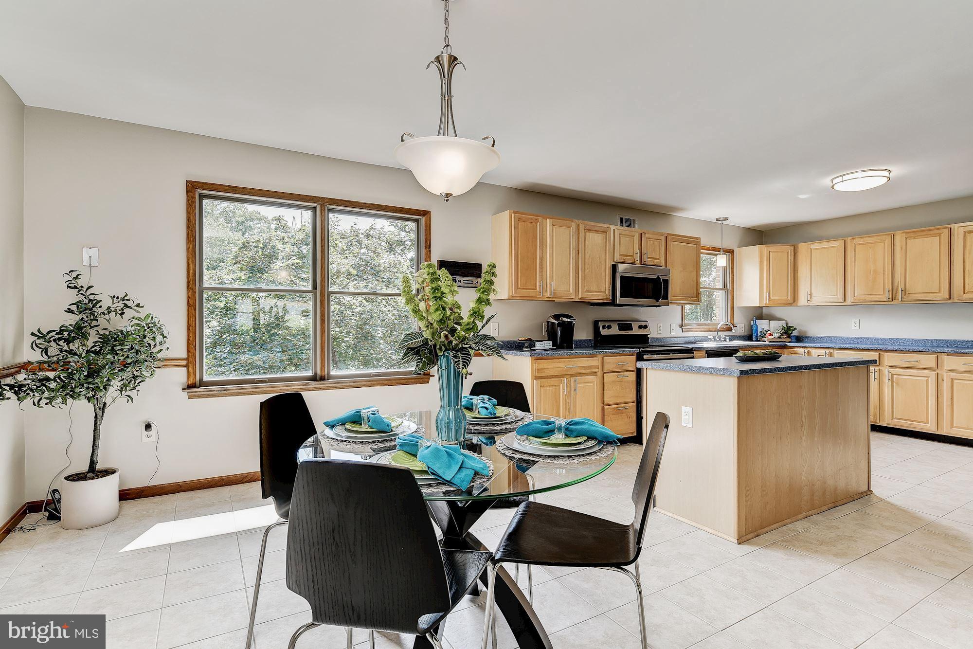 10685 Stansfield Road Laurel, MD 20723 - Photo 9 of 48 Enjoy meals in the bright dining room.