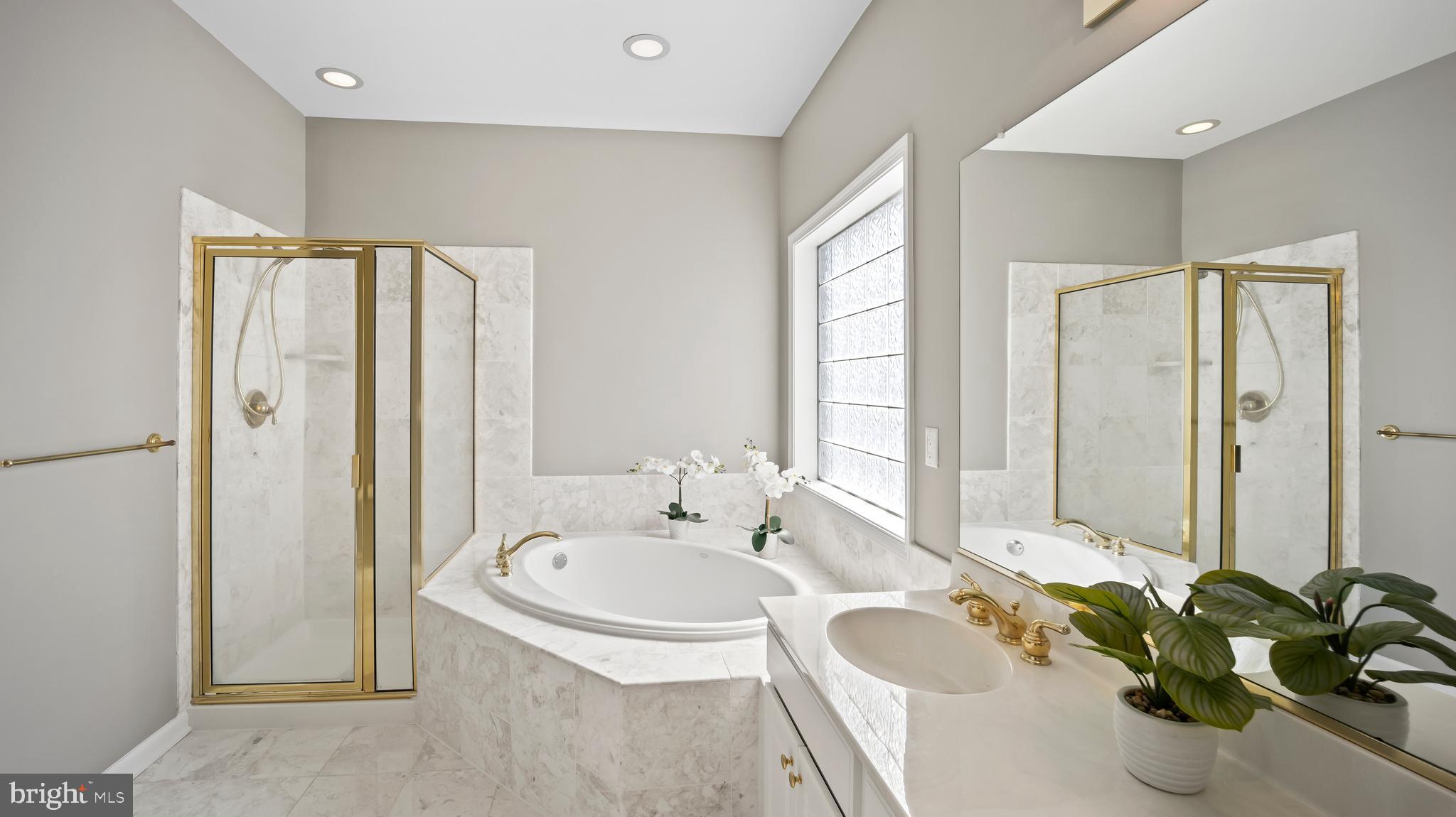 8 Bethpage Drive Skillman, NJ 08558 - Photo 19 of 36 a bathroom with a tub sink and mirror