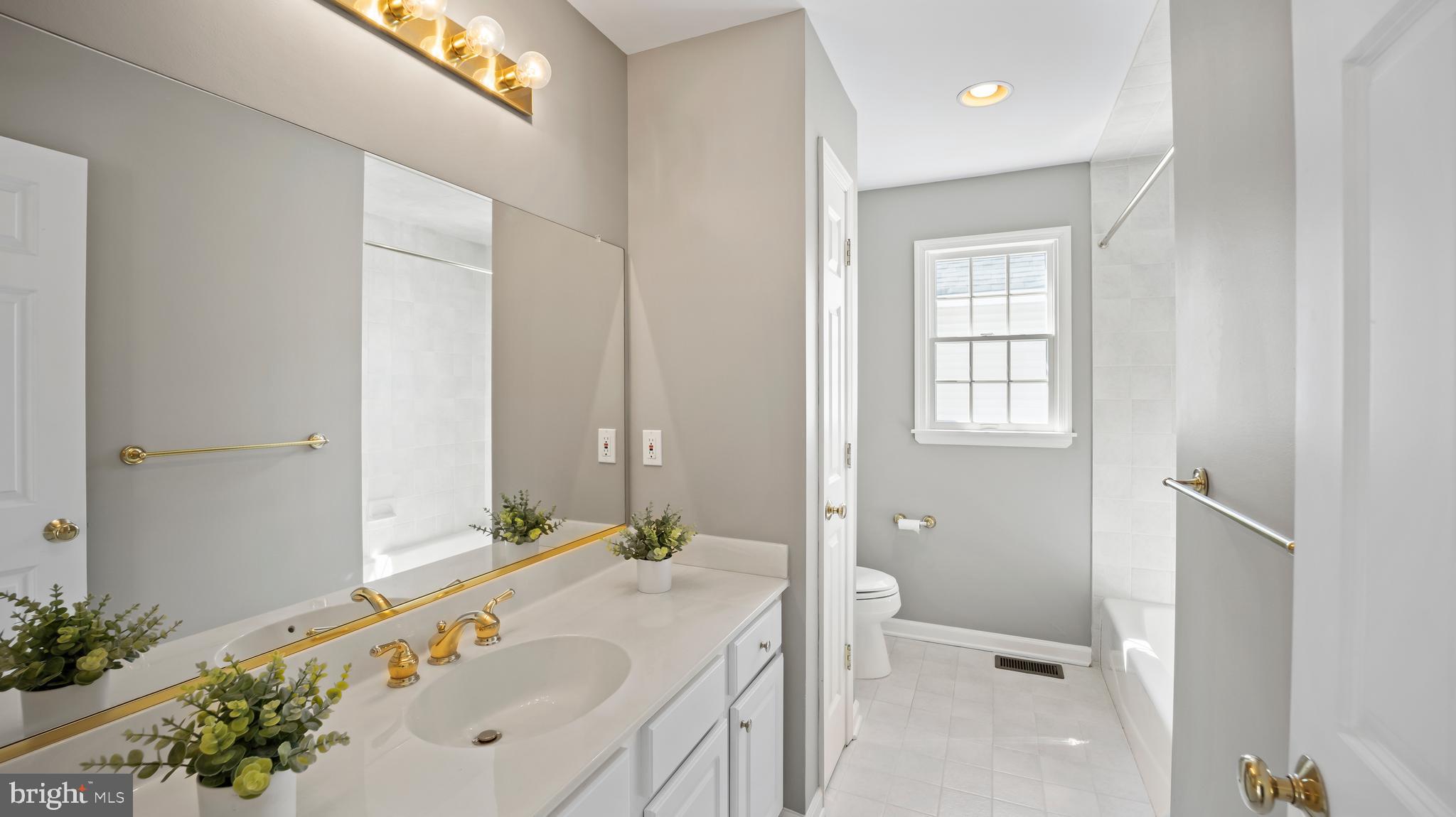 8 Bethpage Drive Skillman, NJ 08558 - Photo 30 of 36 a bathroom with a tub sink and mirror