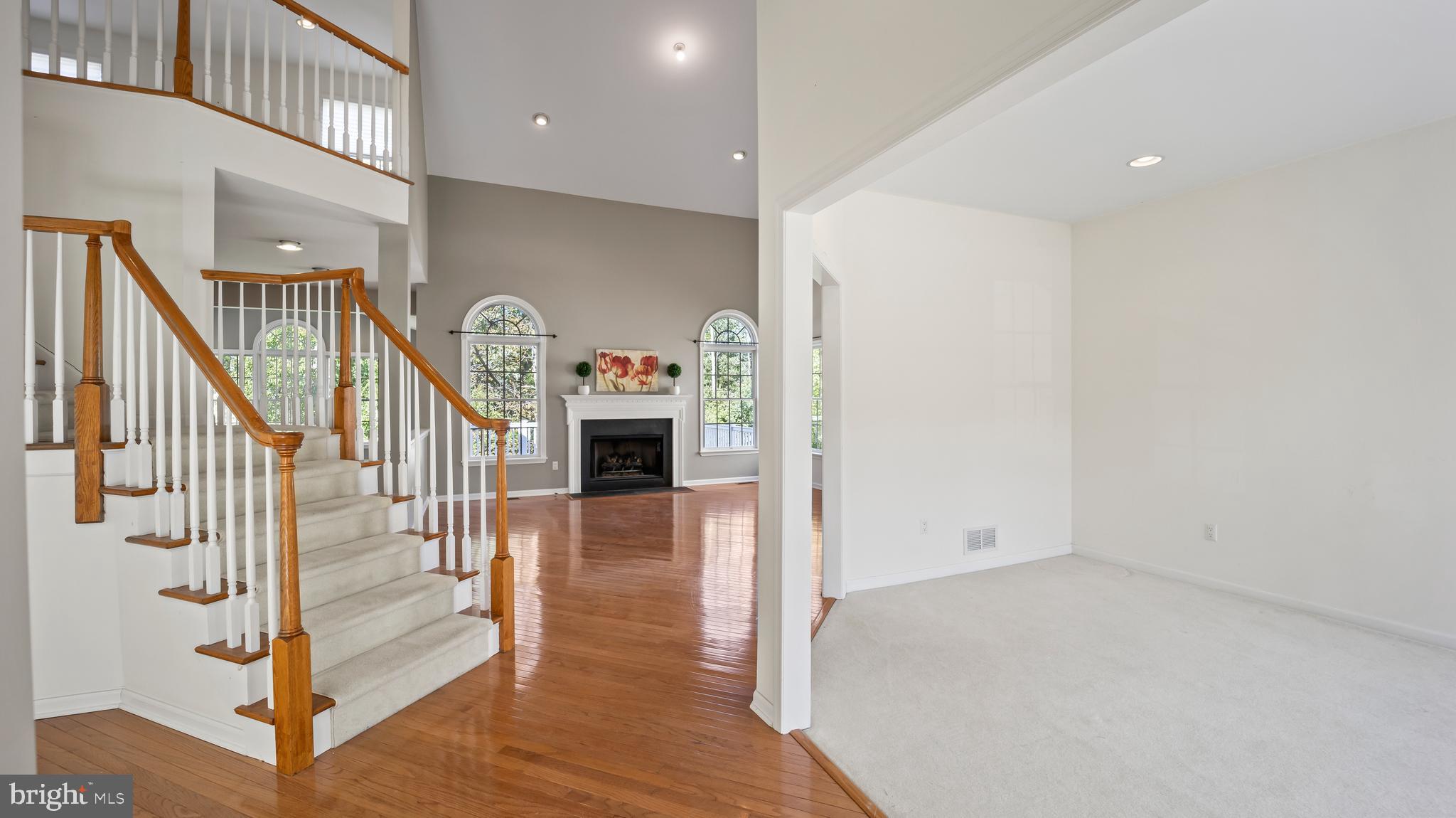 8 Bethpage Drive Skillman, NJ 08558 - Photo 4 of 36 a view of entryway with stairs and wooden floor