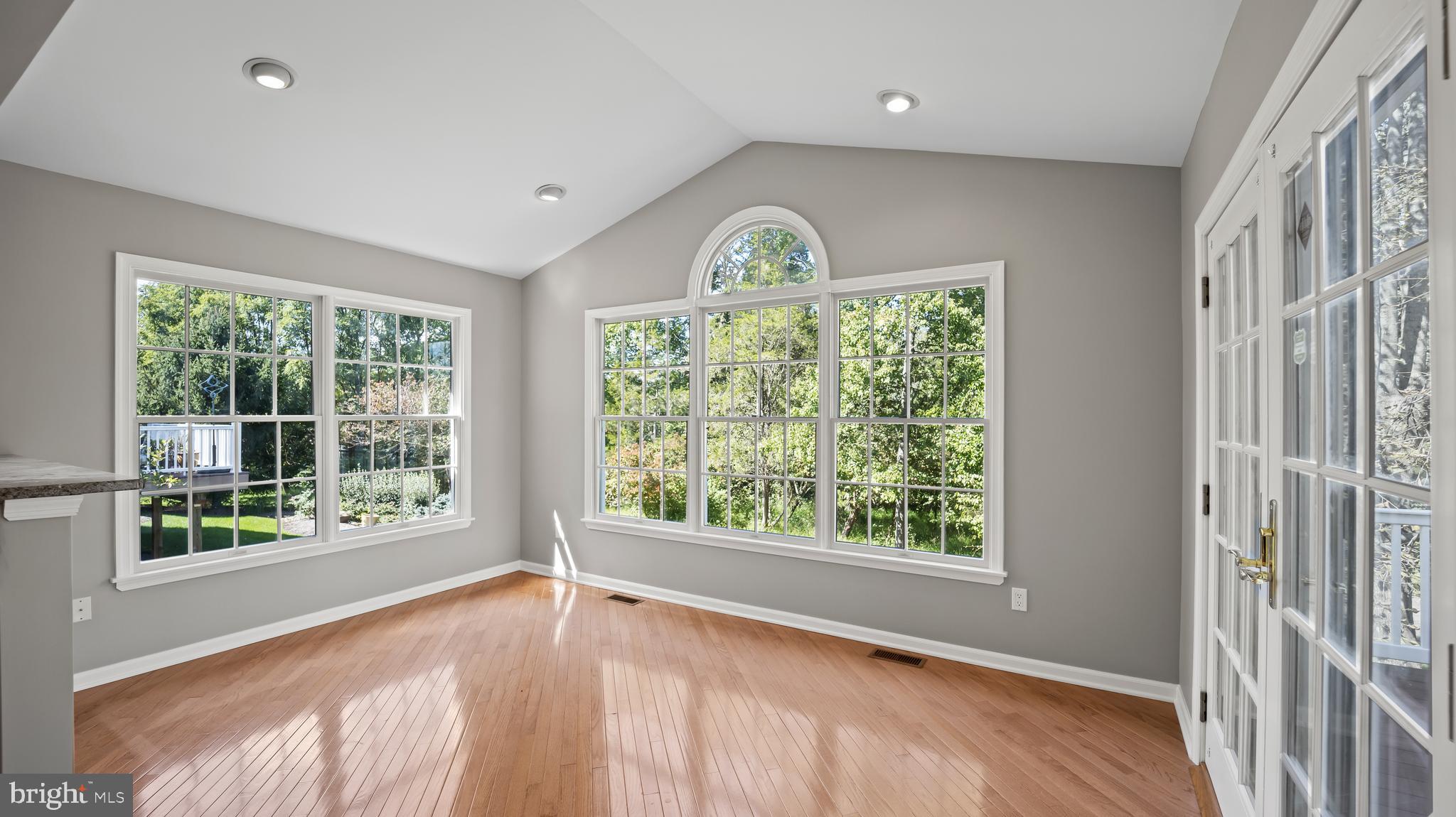 8 Bethpage Drive Skillman, NJ 08558 - Photo 10 of 36 a view of an empty room with wooden floor and a window