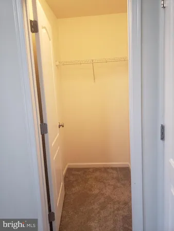 a white toilet sitting next to a bath tub and a shower