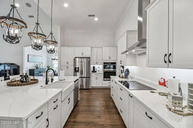 a white toilet sitting next to a bathroom sink