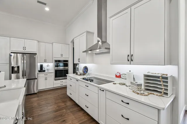a bathroom with a sink a large mirror and shower