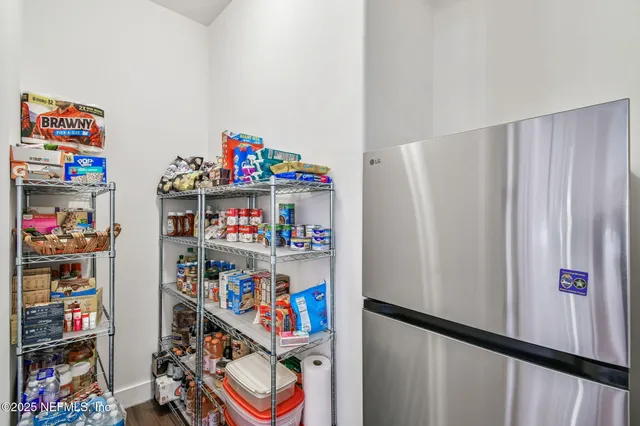 a workspace with wooden floor and windows