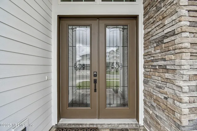 a kitchen with stainless steel appliances kitchen island a large island in the center and wooden floors