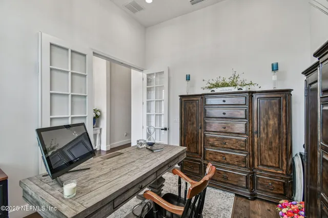 a bedroom with a bed and a dresser in it