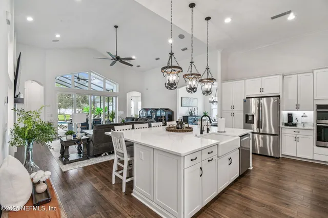 a bedroom with a bed couch and a window