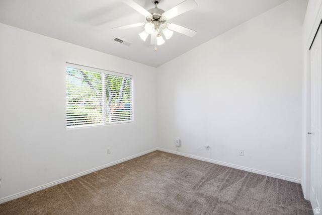1630 East 2450th Street South, Unit 263 St. George, UT 84790 - Photo 11 of 24 Carpeted room featuring a ceiling fan with integrated lighting, a window with horizontal blinds, and white baseboards
