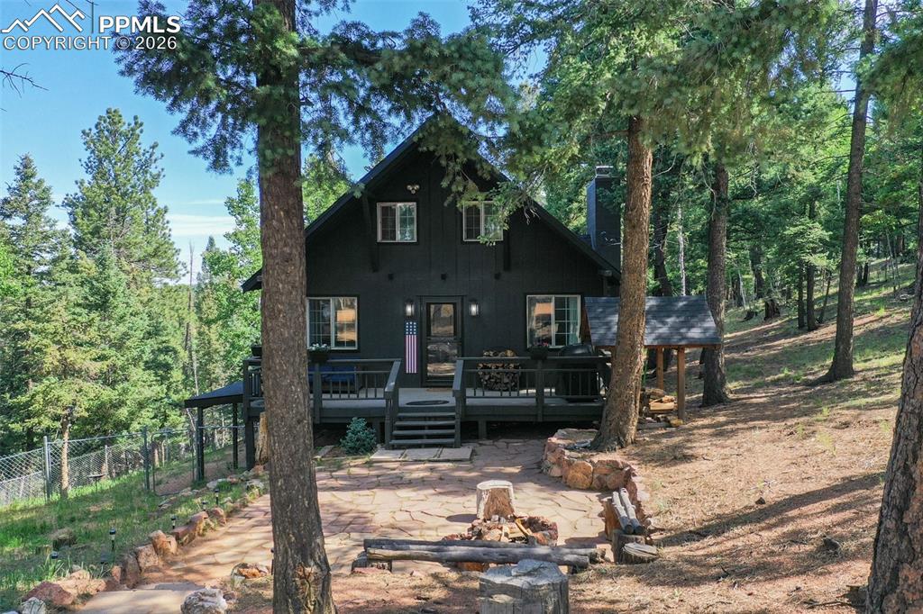 377 Ridge Road Divide, CO 80814 - Photo 2 of 50 a front view of a house with a tree