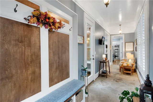 a view of room with guitars and wooden floor