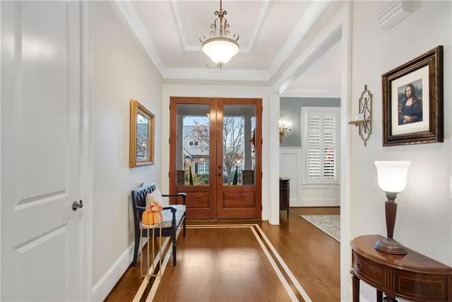 a view of a livingroom with furniture window and wooden floor