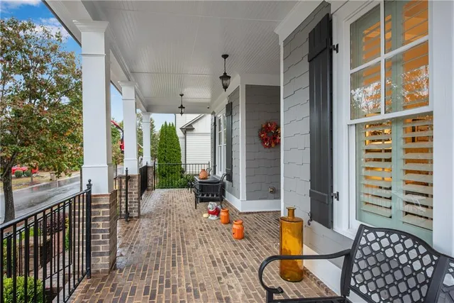 a view of a swimming pool with a patio and a garden