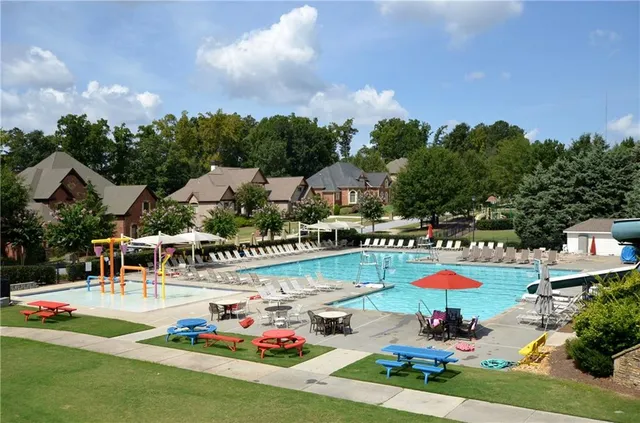 swimming pool view with a seating space
