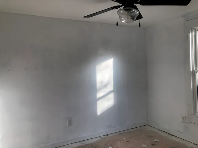 a view of a window in an empty room