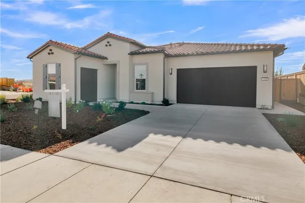 a front view of a house with yard
