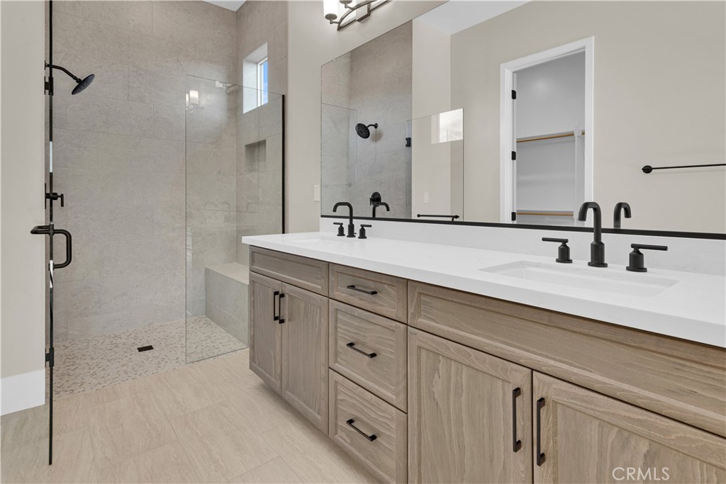 1336 Cava Road Paso Robles, CA 93446 - Photo 11 of 16 a spacious bathroom with double sink and a mirror