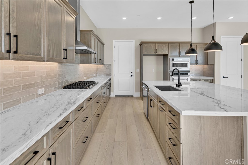 1336 Cava Road Paso Robles, CA 93446 - Photo 3 of 16 a kitchen with stainless steel appliances granite countertop a sink stove and refrigerator