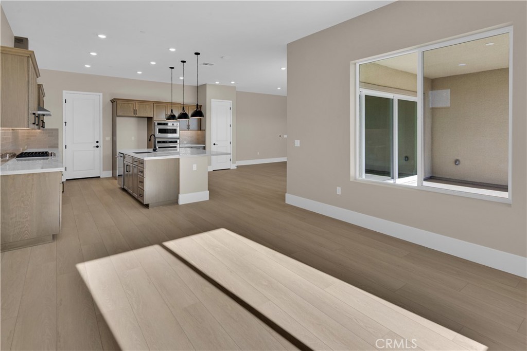 1336 Cava Road Paso Robles, CA 93446 - Photo 5 of 16 a living room with stainless steel appliances kitchen island a stove a refrigerator a sink dishwasher with a dining table and chairs