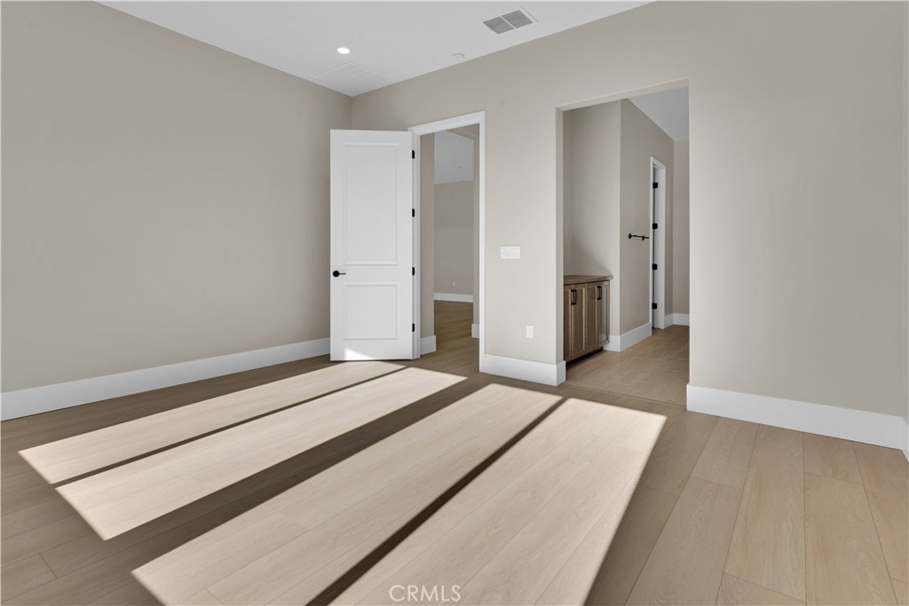 1336 Cava Road Paso Robles, CA 93446 - Photo 10 of 16 a bedroom with a bed and wooden floor